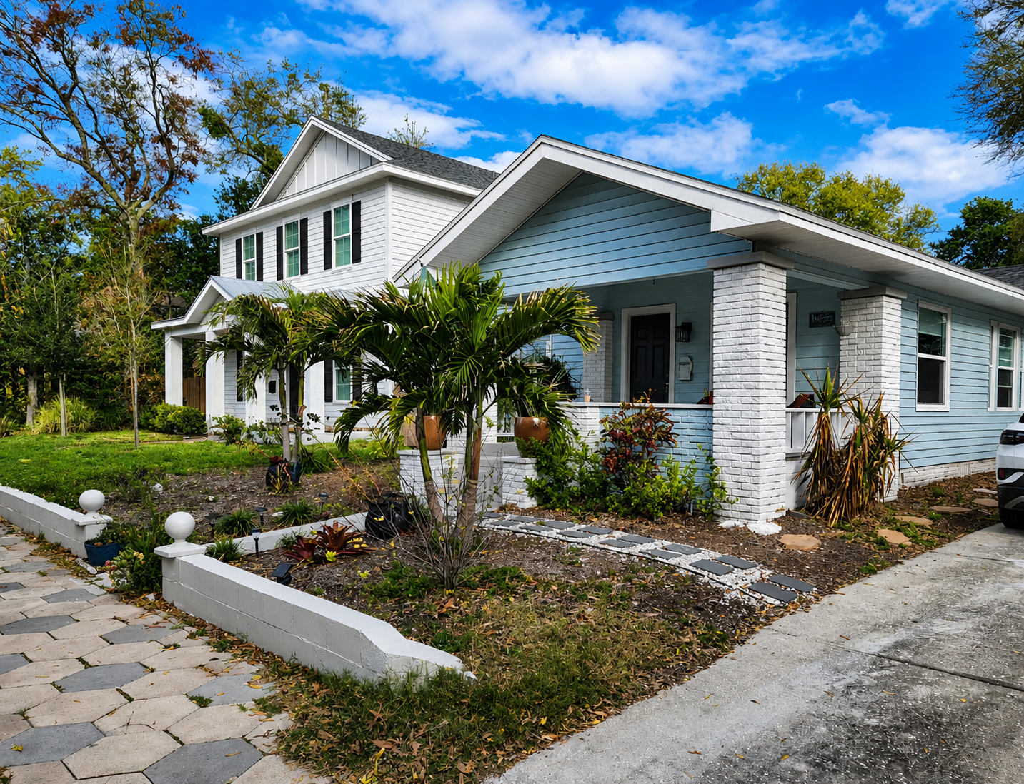 Before: a bare, patchy front yard along the walkway to the porch
